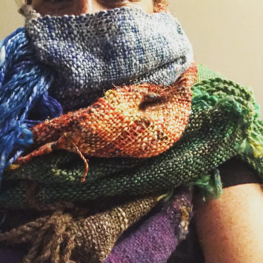 a picture of a person covered in many scarves